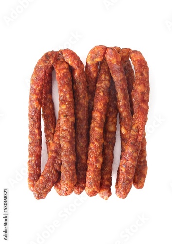 Traditional thin smoked, dry sausage, isolated. Polish meat sausage, kabanosy, a packshot photo for package design.