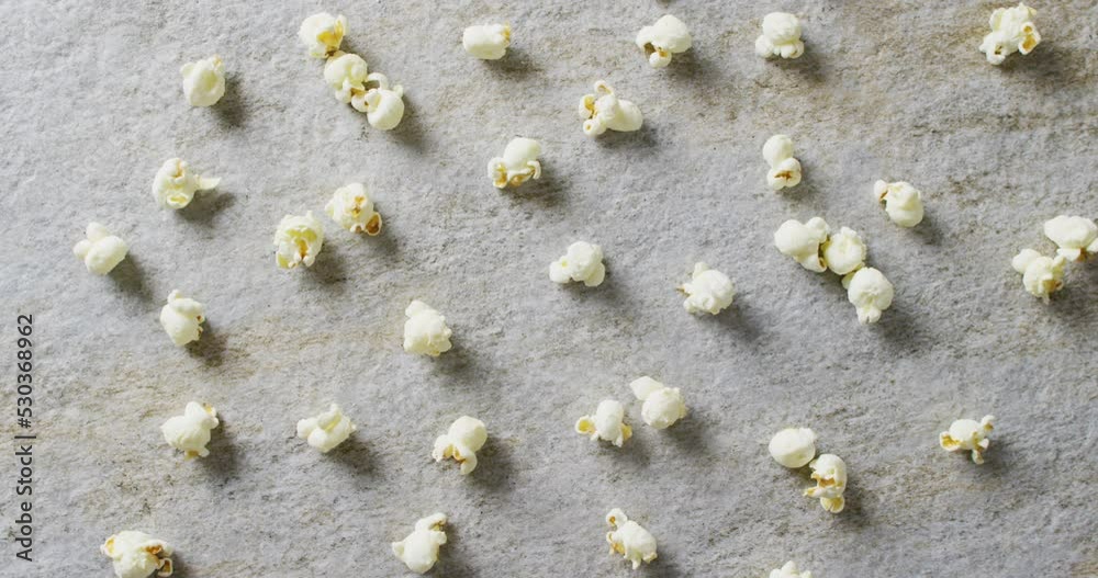 Video of close up of popcorn on gray background Video of close up of popcorn on gray background
