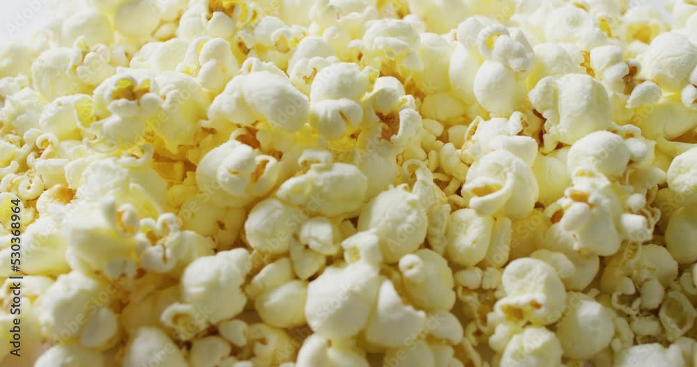 Video of close up of popcorn on white background Video of close up of popcorn on white background