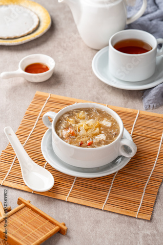 Shark fin soup (Indonesia : Soup Sirip Ikan Hiu) is a popular soup in Chinese cuisine which is usually served on special occasions such as weddings or banquets. photo