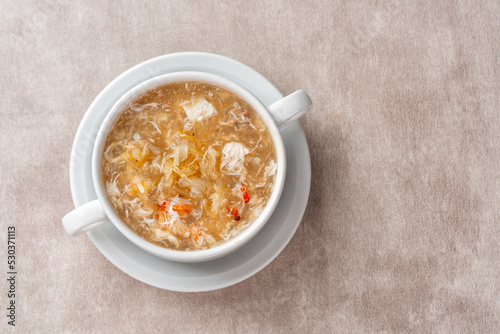 Shark fin soup (Indonesia : Soup Sirip Ikan Hiu) is a popular soup in Chinese cuisine which is usually served on special occasions such as weddings or banquets. photo