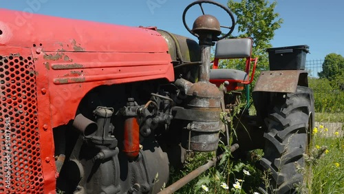 The red old tractor truck in the garage as seen on a closer look in Estonia