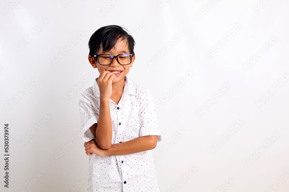 Happy asian boy standing while smiling. Isolated on white background with copyspace Happy asian boy standing while smiling. Isolated on white background with copyspace