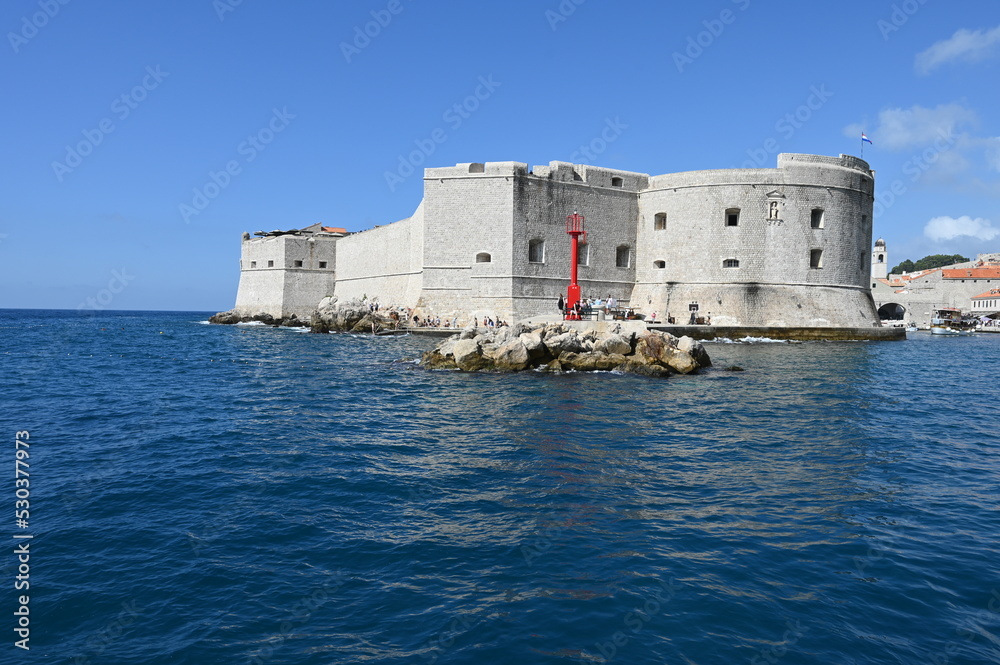 The outer walls of the old walled town of Dubrovnik at Dalmatia in Croatia from the sea. 