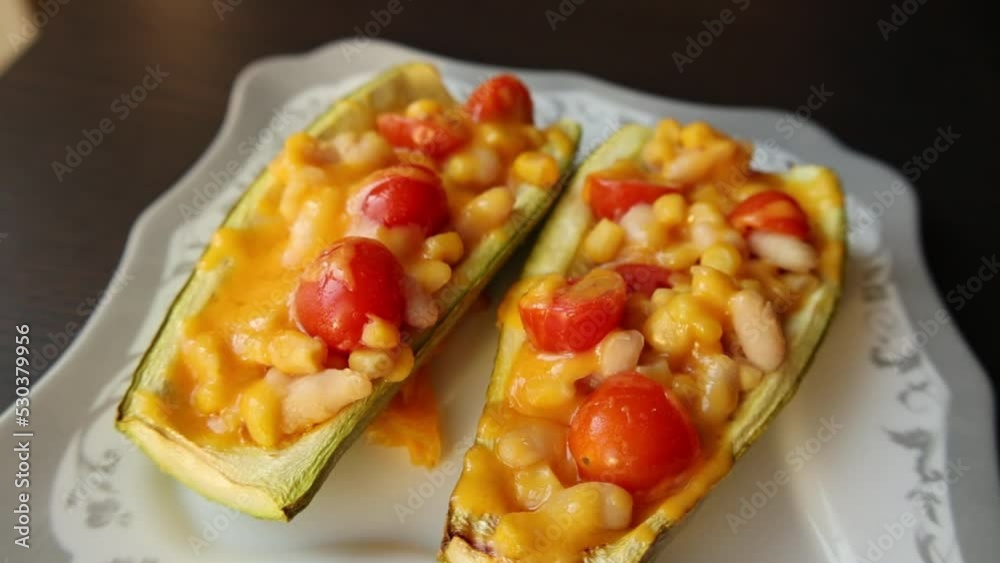 mediterranean food - zucchini stuff with beans corn and cherry tomatoes toped with grated cheddar cheese make at home mediterranean food - zucchini stuff with beans corn and cherry tomatoes toped with grated cheddar cheese make at home