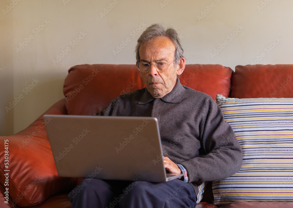 Older man with computer Older man with computer