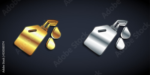 Gold and silver Canister for motor machine oil icon isolated on black background. Oil gallon. Oil change service and repair. Long shadow style. Vector