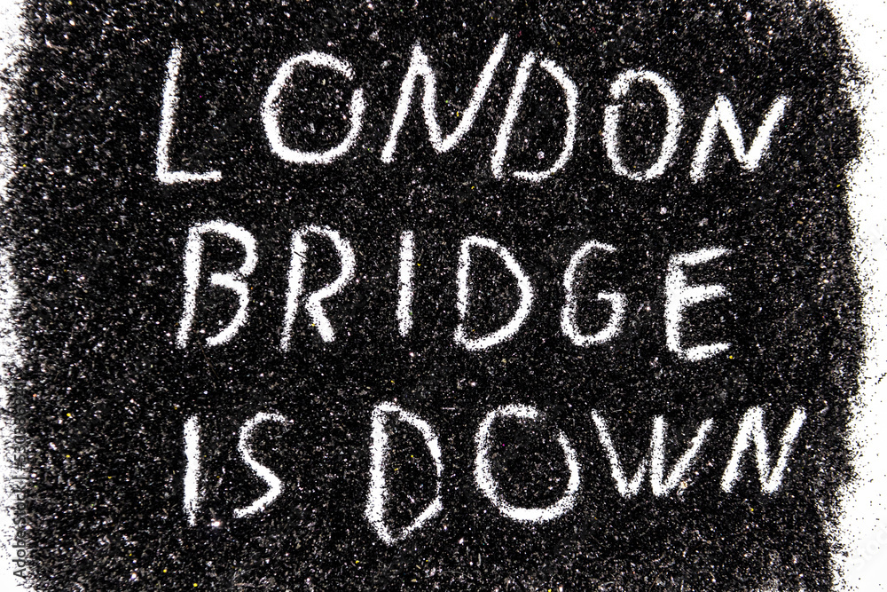 Fototapeta premium It is code name of the operation when the Queen of the England die written on the black glitter - LONDON BRIDGE IS DOWN.