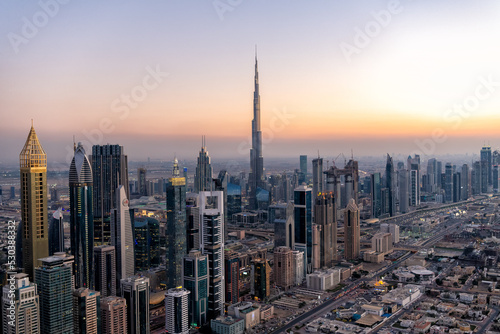 Aerial sunset view Dubai skyscrapers Arabian Gulf UAE