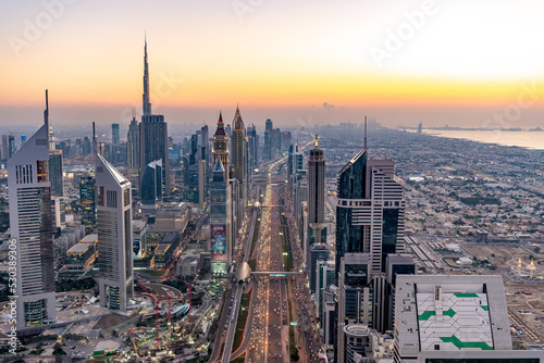 Aerial Dubai cityscape at sunset Sheikh Zayed Road photo