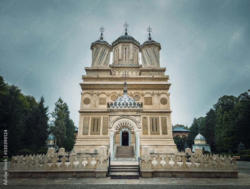 Curtea de Arges old Christian Orthodox monastery in Romania. Beautiful Cathedral facade and architectural details from the legend of Manole craftsman