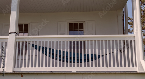 A hammock on the wooden balcony. 