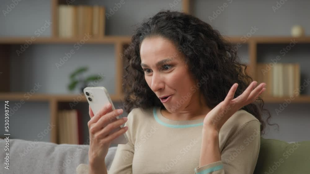 Close up reaction happy wow shock delight amazed female face at home surprised Caucasian Hispanic Latino30s woman chatting phone using mobile bet app read good news winning looking smile to camera Close up reaction happy wow shock delight amazed female face at home surprised Caucasian Hispanic Latino30s woman chatting phone using mobile bet app read good news winning looking smile to camera