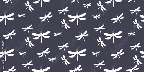Seamless pattern Dragonflies on dark blue for printing on fabric.