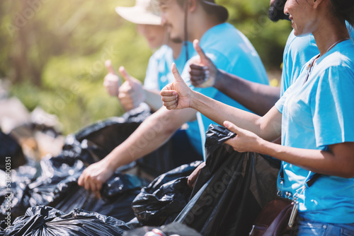 Cuadro en lienzo Group of diverse people volunteer teamwork ,volunteering spirit help to clean park area in environment conservation