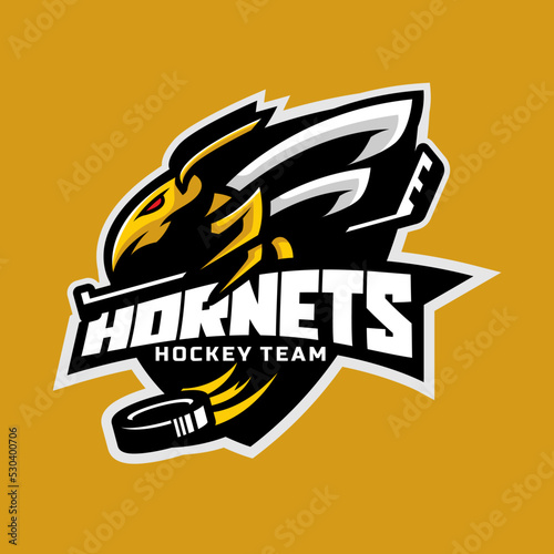 Hornets logo for the ice hockey team logo. vector illustration. With a combination of shields badge, puck and ice hockey stick