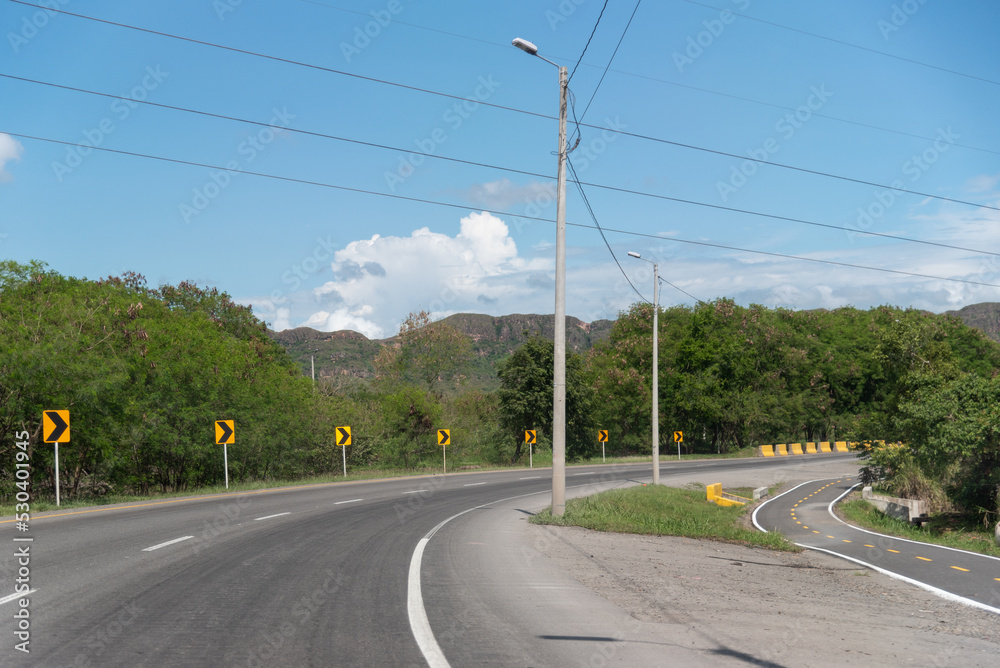 Electric pole in a curve of a rural road in Colombia Electric pole in a curve of a rural road in Colombia