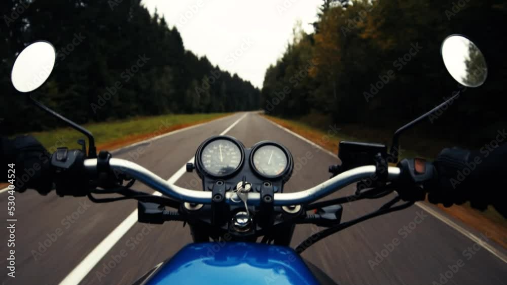 Motorcycle adventure, ride on asphalt forest road in autumn. First-person view. Motorcycle adventure, ride on asphalt forest road in autumn. First-person view.