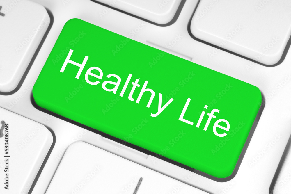 Green button with Healthy Life words on the keyboard, healthy concept Green button with Healthy Life words on the keyboard, healthy concept