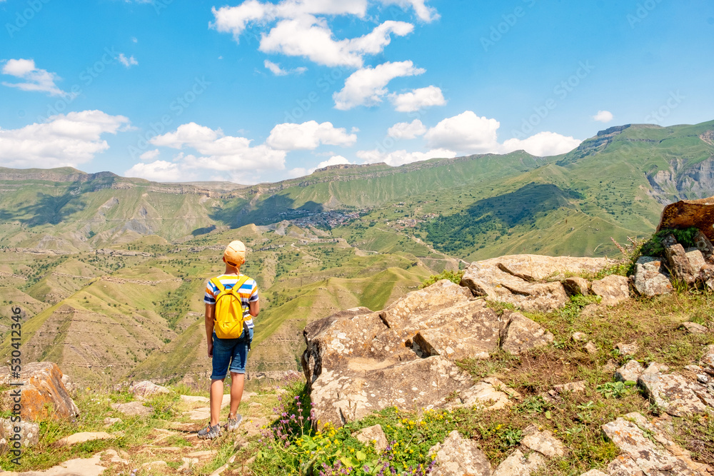 Traveler Teenager boy hands raised mountains landscape. Travel happy emotions success concept summer vacations outdoor