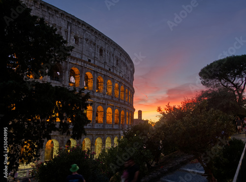 The  Colosseum located in Rome Italy is an oval amphitheater in the centre of the city. It is the largest ancient amphitheater ever built.