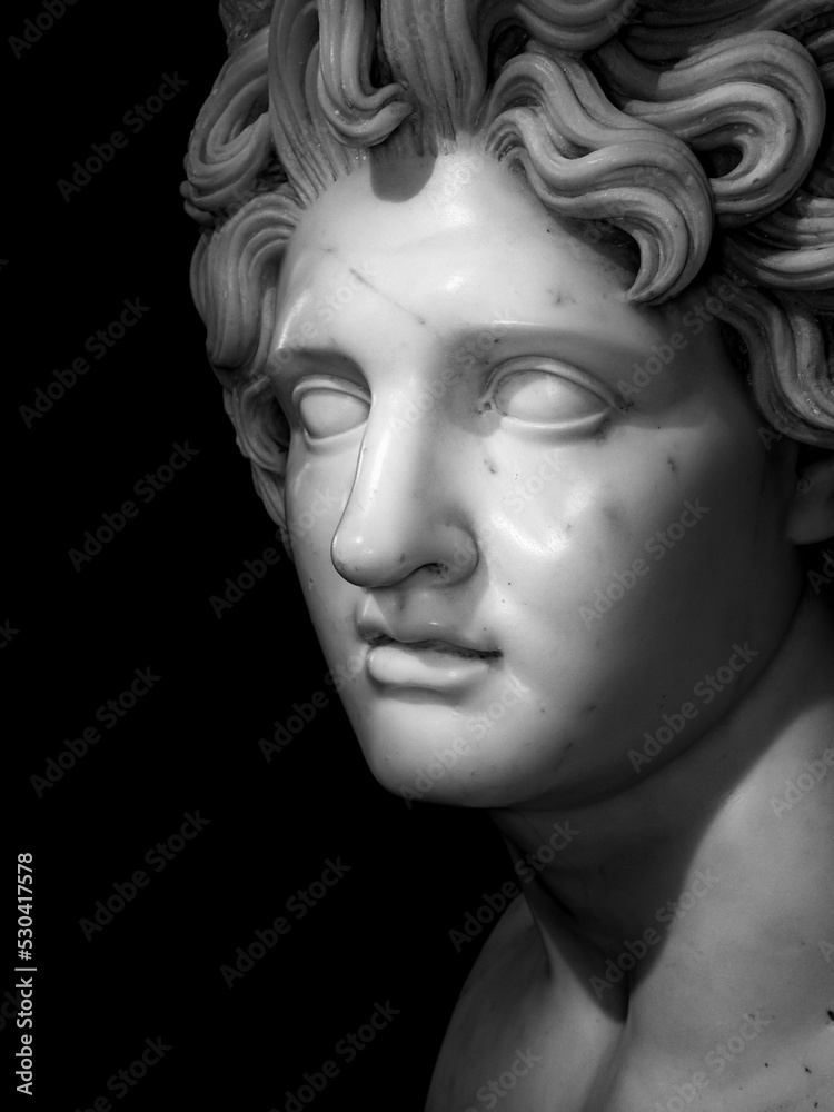 head of marble statue with black background.  Plaster sculpture man face.