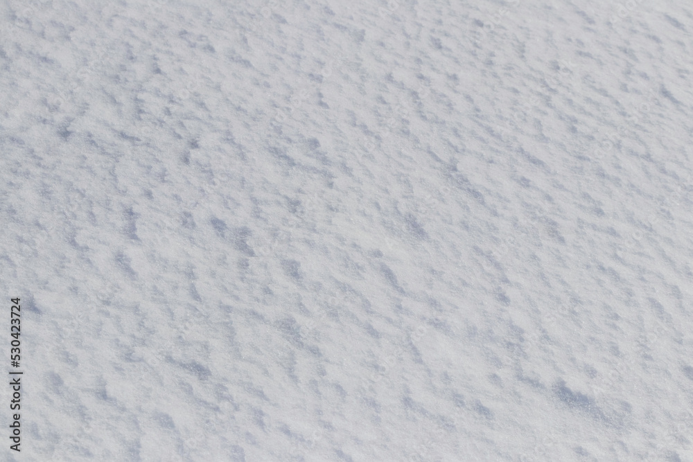 Snow background. A frozen uneven snow surface Snow background. A frozen uneven snow surface