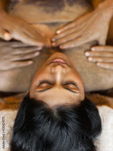 Woman Receiving Udwarthanam, Ayurvedic Powder Massage, Palakkad, Kerala, India. photo
