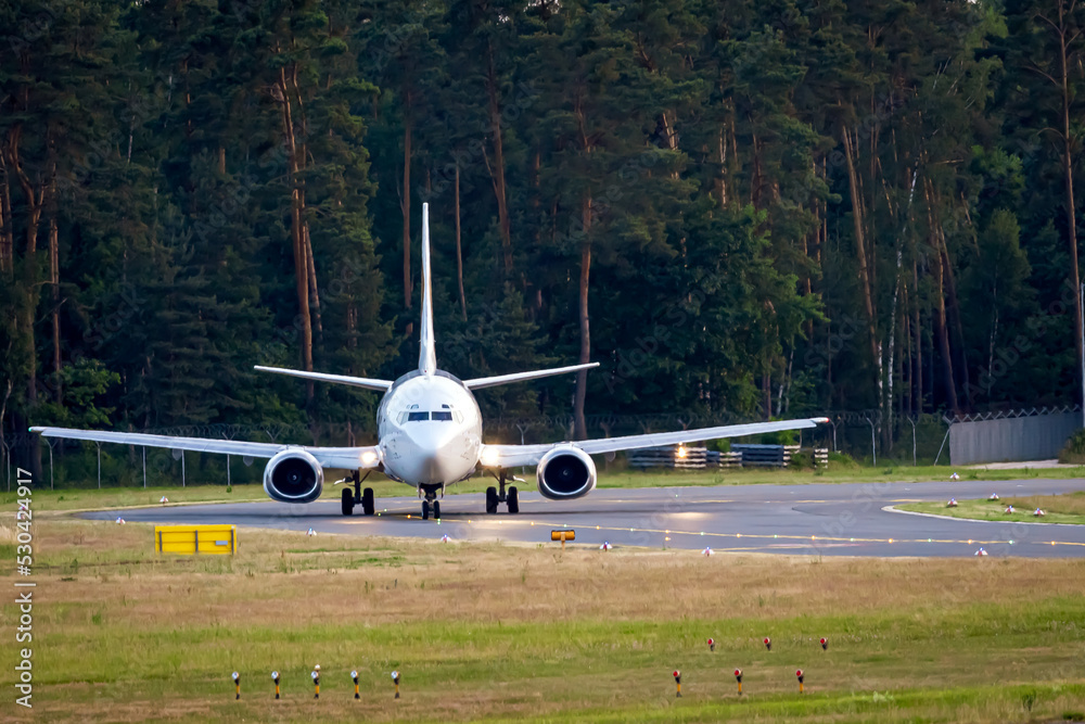 Commercial airplane on the way to the runway with front to the camera. Waiting for takeoff clearance. Commercial airplane on the way to the runway with front to the camera. Waiting for takeoff clearance.