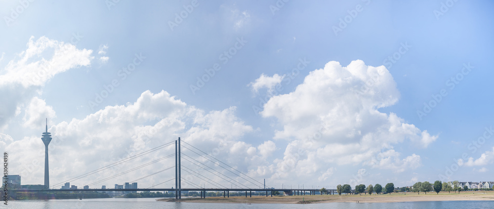Panoramic photo of the teleradio tower and bridge from the embankment in Dusseldorf, North Rhine Westphalia, Germany. 