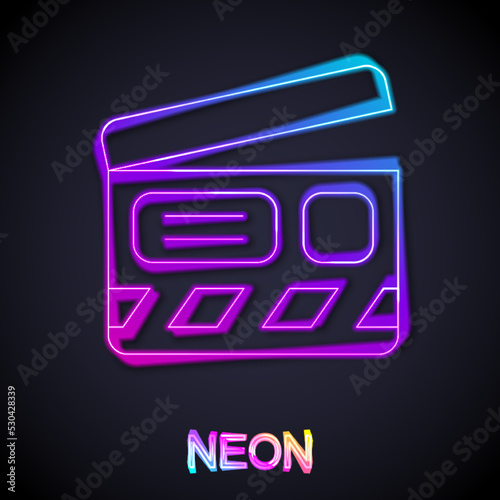 Glowing neon line Movie clapper icon isolated on black background. Film clapper board. Clapperboard sign. Cinema production or media industry. Vector