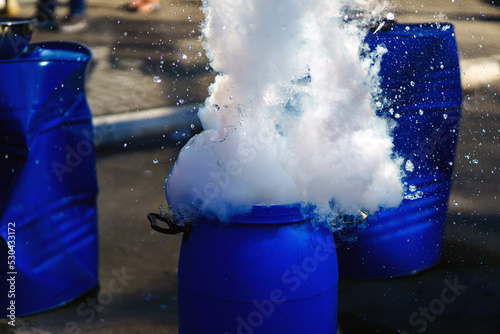 Liquid nitrogen exploded in a plastic barrel a lot of splashes and steam
