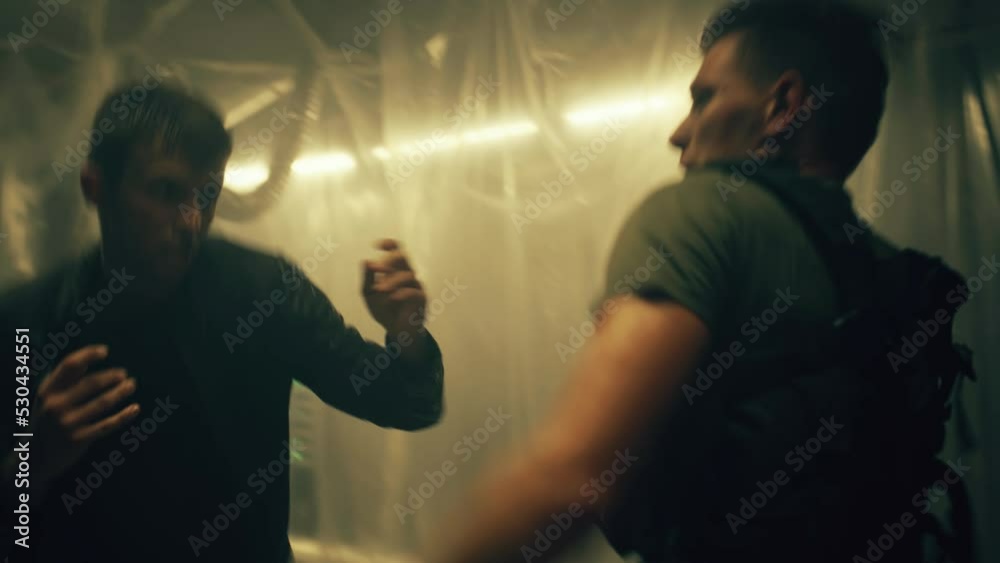 Movie scene montage for tv screens. Two characters fight in a dark room. Action movie scene fight playback scene 2.