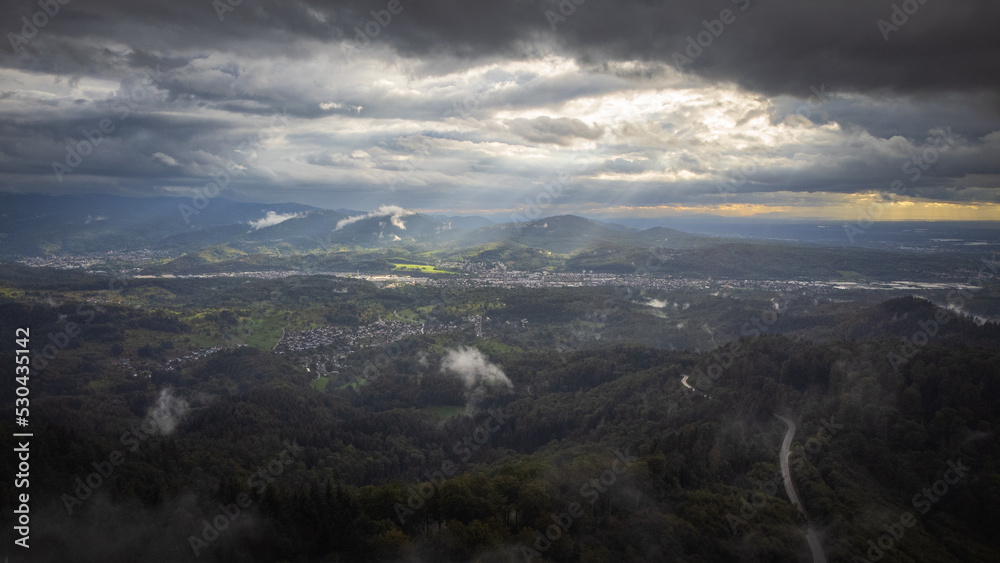 The sun breaks through the cloud cover and shines on the beautiful Murg Valley in the German Black Forest