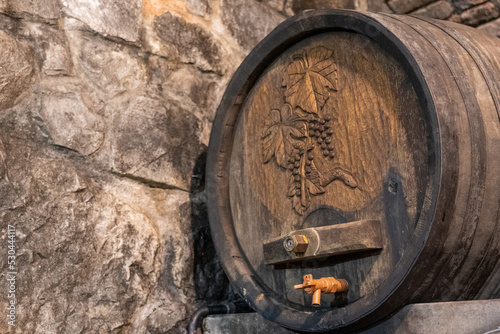 Old wooden wine barrel with grape motif. Bela Krajina, Slovenia