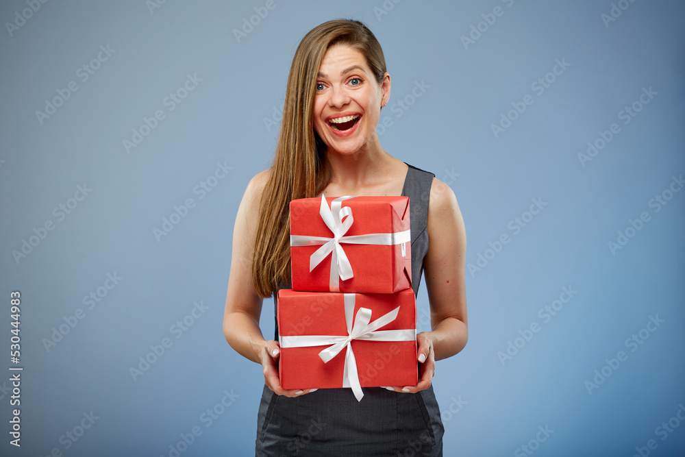 Happy business woman holding red gift boxes. Happy business woman holding red gift boxes.