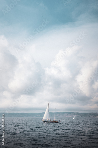 Sailboat in freedom in the middle of the ocean enjoying the immensity and force of nature between Mediterranean islands