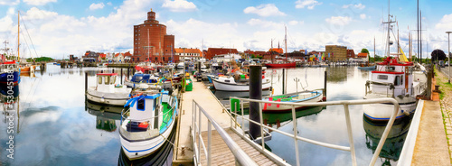 Photographie Historic harbor with fishing boats and round silo, the landmark of Eckernförde