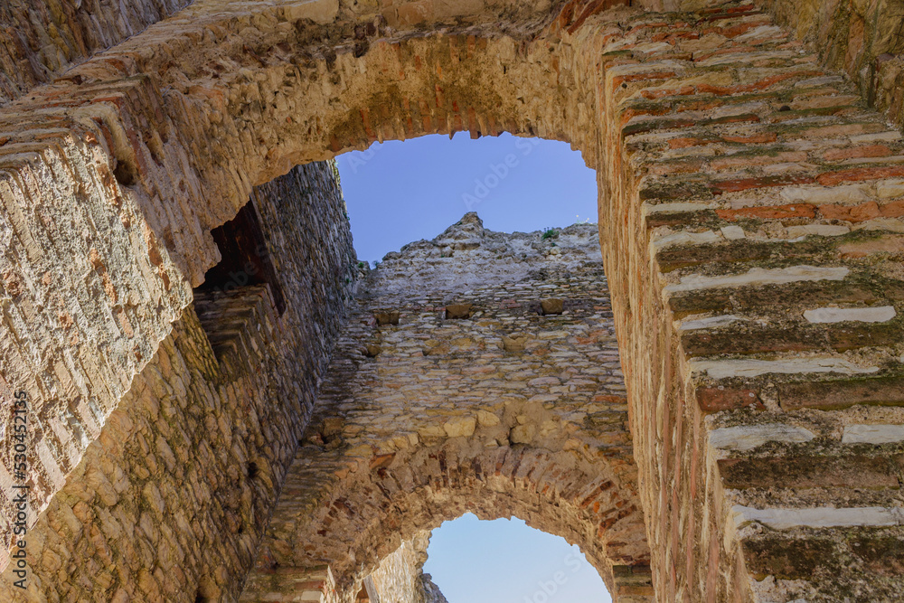 Low angle view of ancient roman ruins in Sirmione, Italy. Copy space.