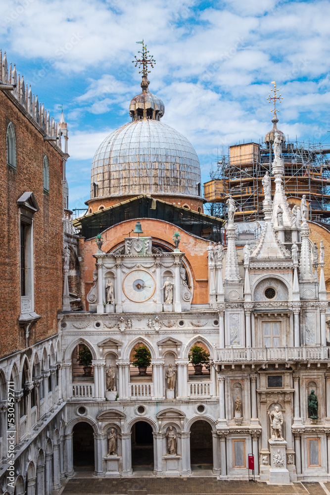 St. Mark’s Basilica stands above the courtyard of the Doge's Palace in Venice Italy