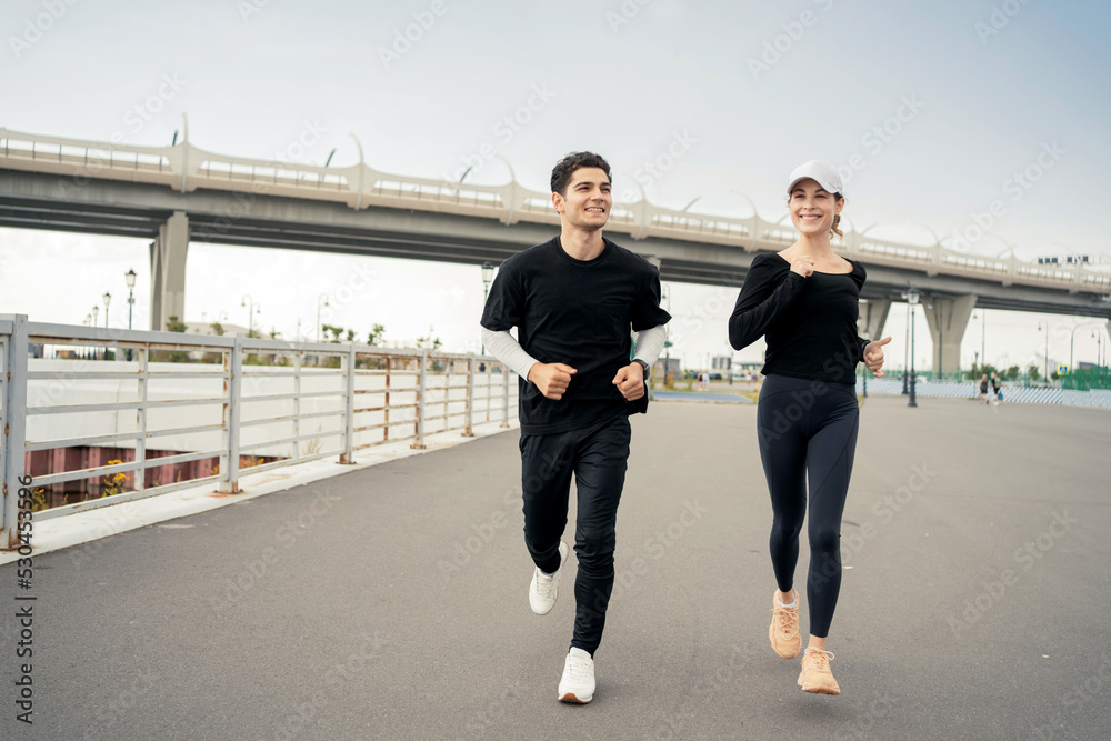 Fototapeta premium Friends runners fitness training in sportswear, running in sneakers.
