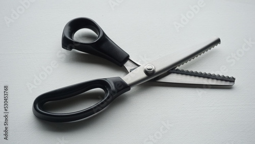 zigzag scissors on white background