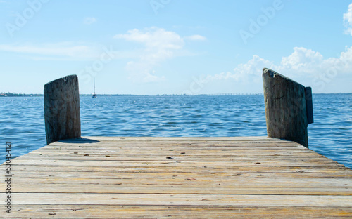 The end of a wooden dock, on the river in Florida
 photo