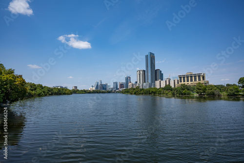 Austin city skyline view from the boardwalk with ladybird lake on a sunny day