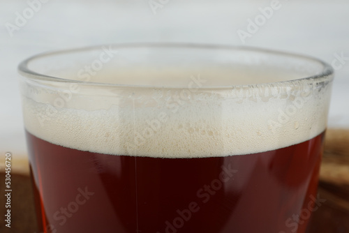Glass of delicious kvass on blurred background, closeup