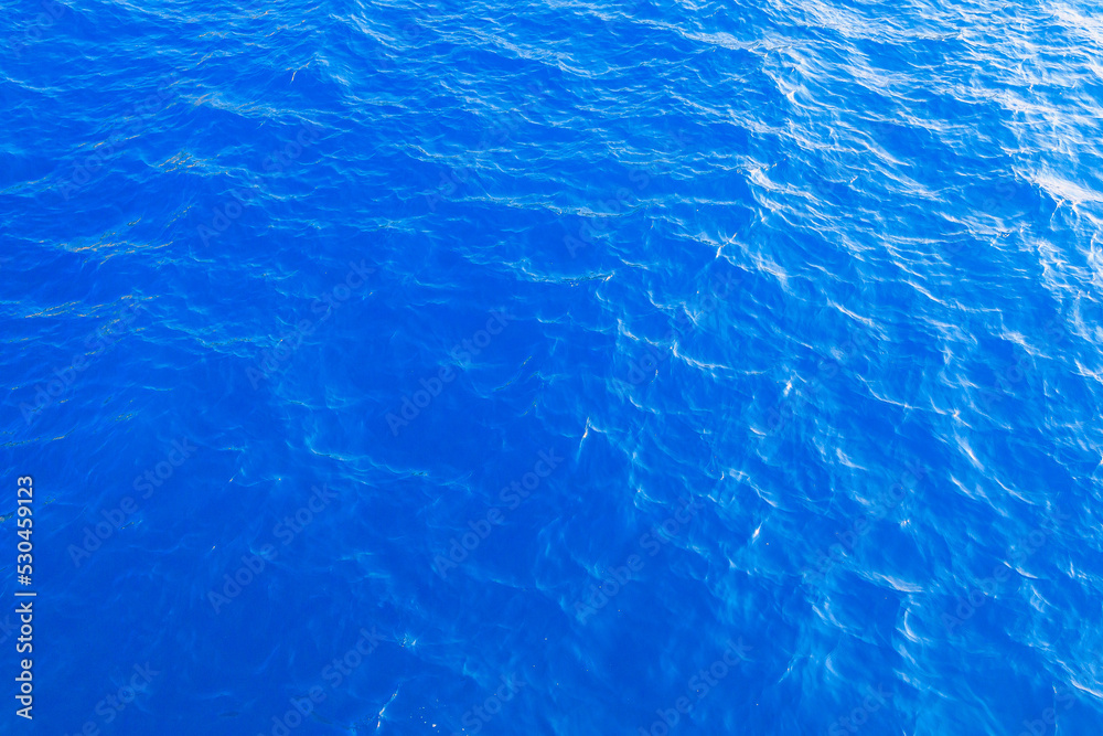 Very nice sea water background or backdrop with selective focus. Small waves of natural water surface texture. Very nice sea water background or backdrop with selective focus. Small waves of natural water surface texture.