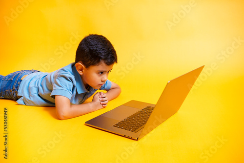 angry boy looking at laptop