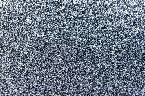 Black and grey carpet texture background closeup view