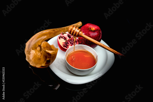 Rosh Hashanah Shofar with Fruit and Honey on a plate