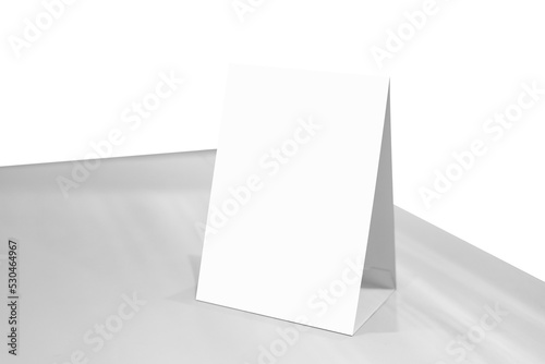 Mock up Label the blank menu frame or or booklets with white sheets paper acrylic tent card on wooden table in Bar restaurant. Can inserting the text of the customer.